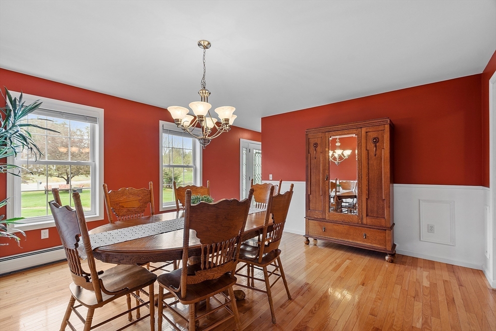 30 Page Epping, NH 03042 - Photo 15 of 42 a view of a dining room with furniture window and wooden floor