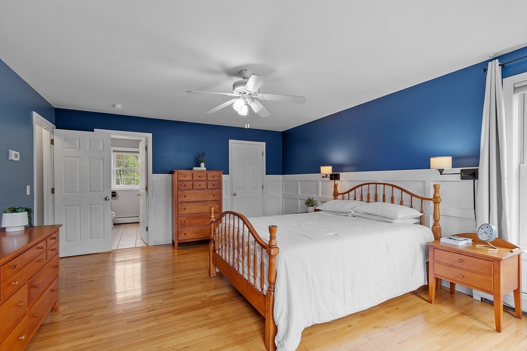 30 Page Epping, NH 03042 - Photo 16 of 42 a bedroom with a bed and wooden floor