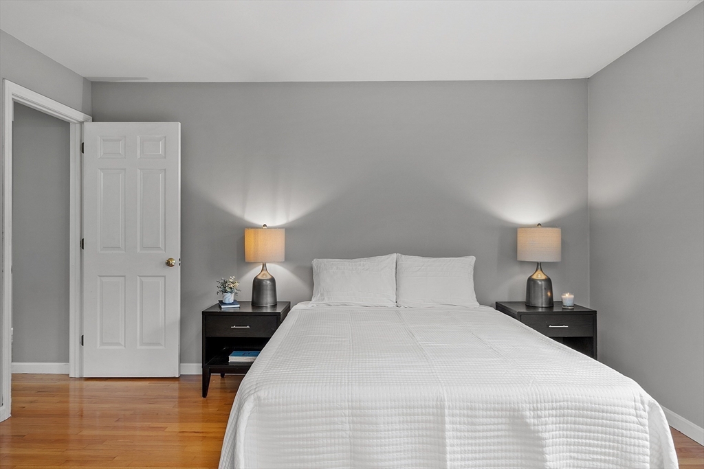 30 Page Epping, NH 03042 - Photo 19 of 42 a bedroom with a bed and wooden floor