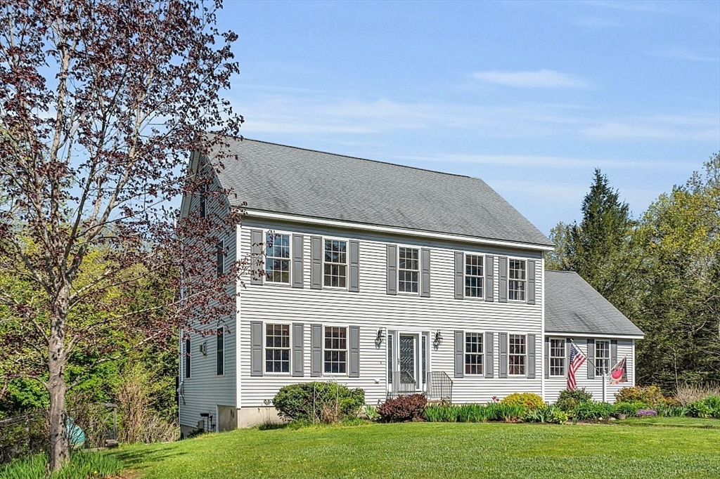30 Page Epping, NH 03042 - Photo 2 of 42 front view of house with a yard