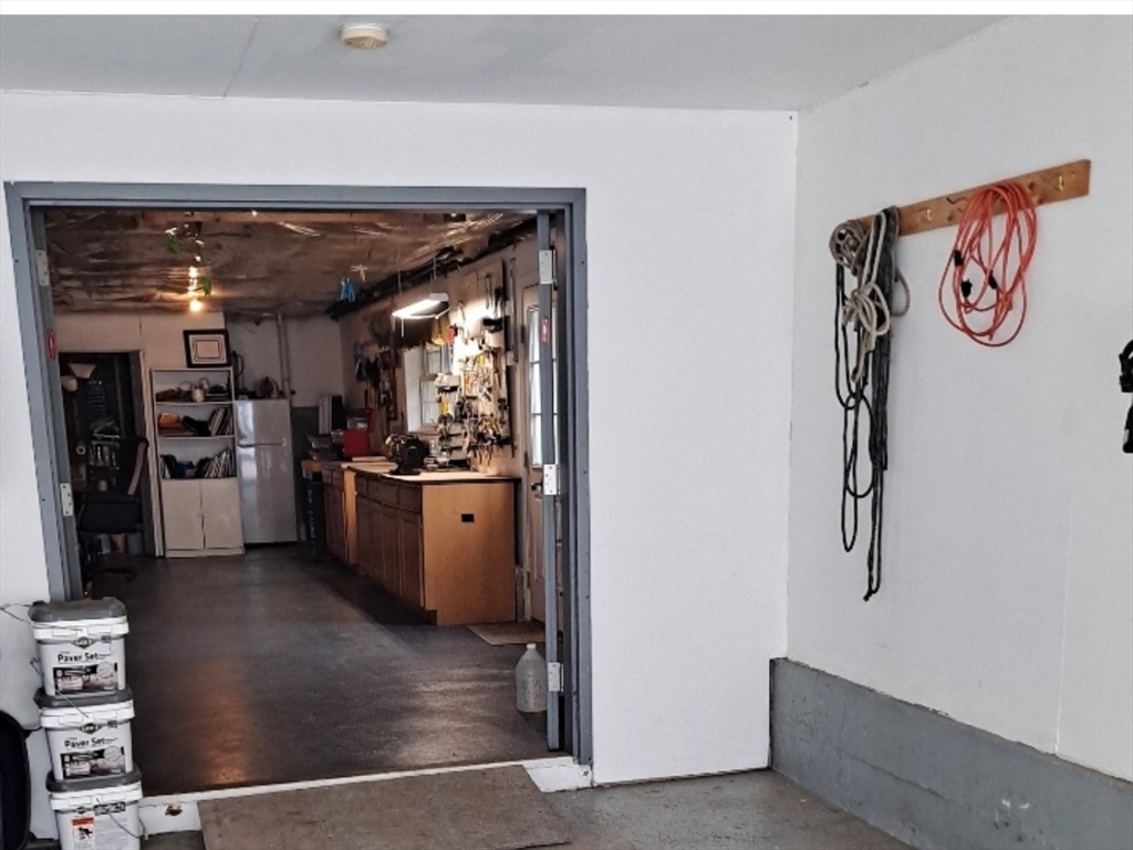 30 Page Epping, NH 03042 - Photo 28 of 42 a view of kitchen with furniture and refrigerator