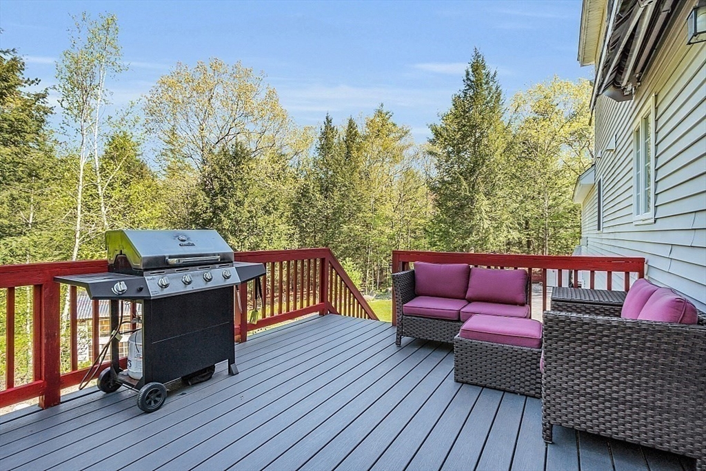 30 Page Epping, NH 03042 - Photo 30 of 42 a balcony with wooden floor table and chairs