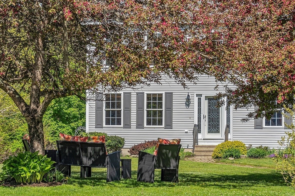 30 Page Epping, NH 03042 - Photo 3 of 42 a front view of house with yard and green space