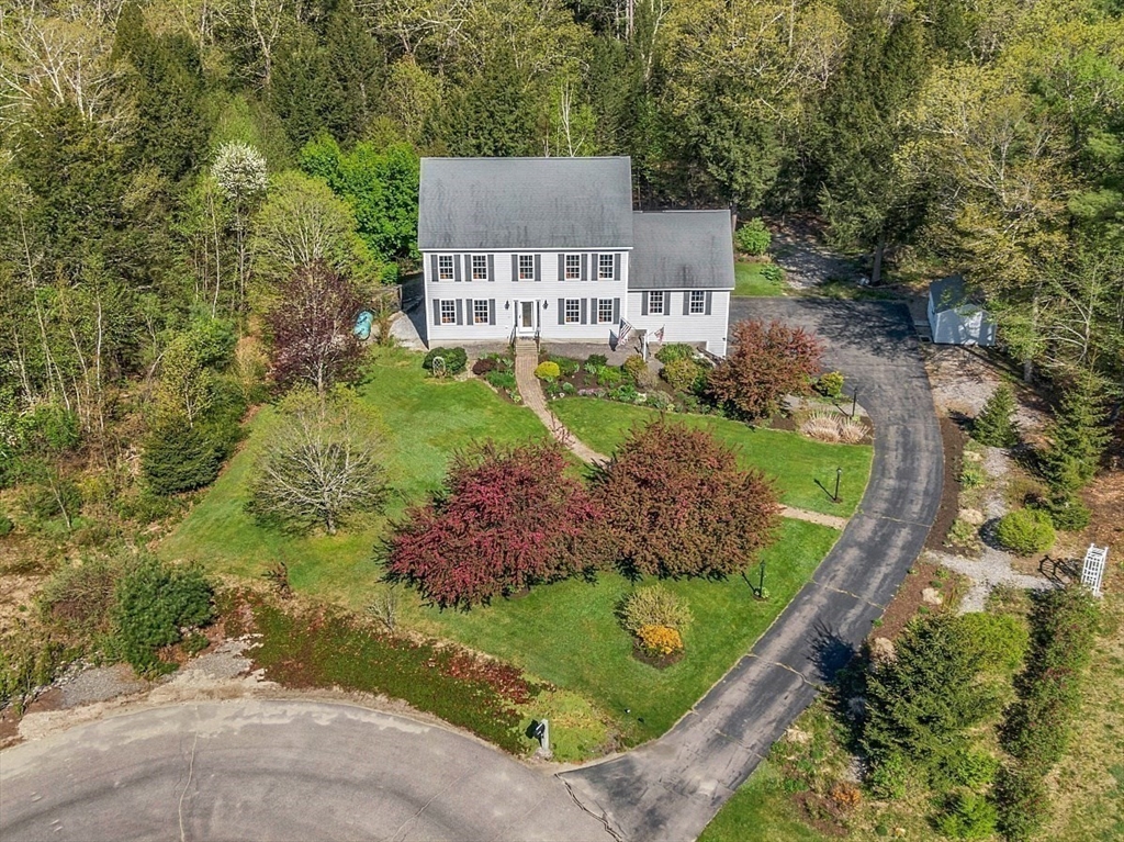 30 Page Epping, NH 03042 - Photo 36 of 42 a aerial view of a house with a yard and large trees