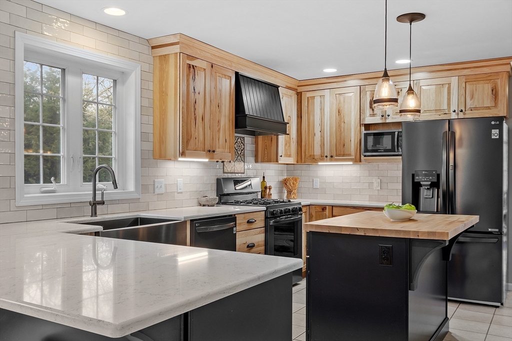 30 Page Epping, NH 03042 - Photo 5 of 42 a kitchen that has a sink cabinets counter space and stainless steel appliances
