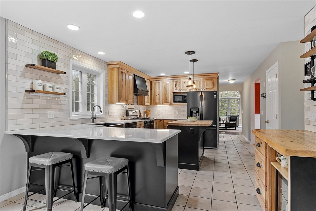 30 Page Epping, NH 03042 - Photo 9 of 42 a large kitchen with a table and chairs