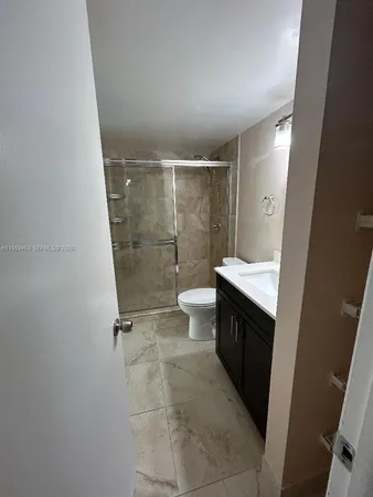 a bathroom with a sink and toilet