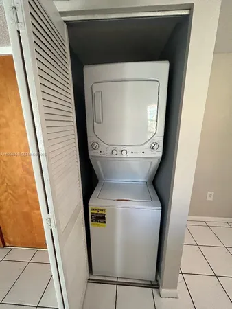 a close view of a utility room with dryer and washer
