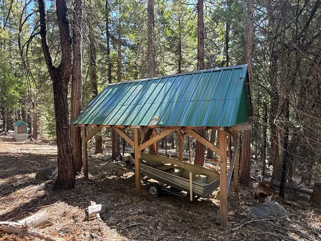 a view of a backyard with a bench