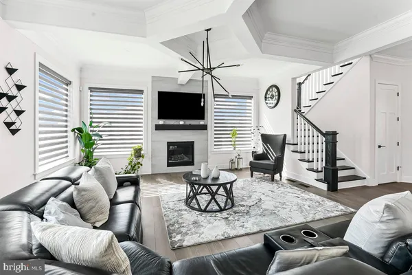 a living room with furniture fireplace and flat screen tv