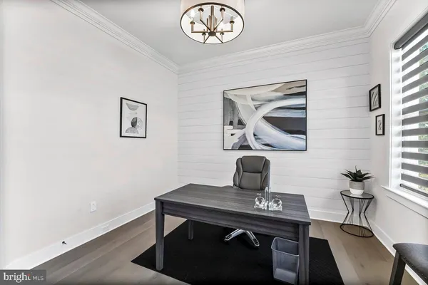 a bedroom with a bed and a television