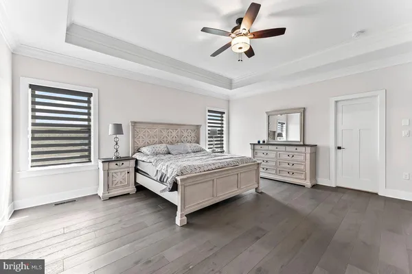 a view of green field with trees in the background