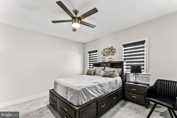 an empty room with a window and a projector