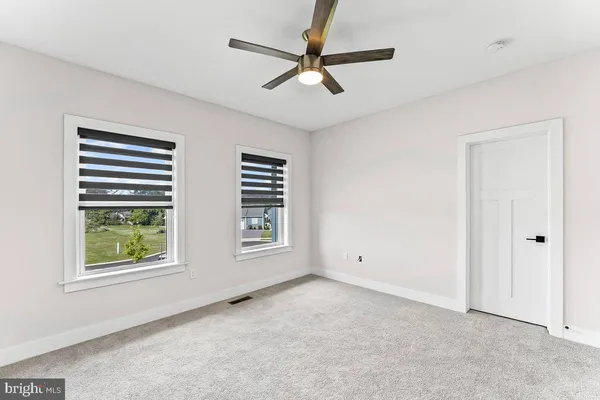 an aerial view of a house with a garden and swimming pool