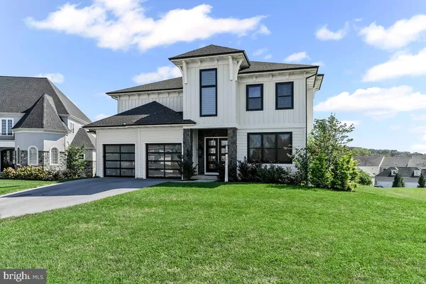 a view of a yard in front of a house