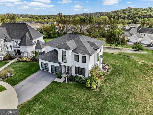 an aerial view of a house with a yard