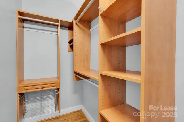 a bathroom with a shower sink and mirror