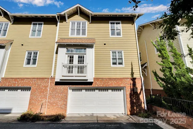 an aerial view of a house with yard swimming pool and outdoor seating