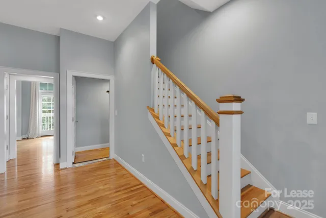 a view of an entryway with wooden floor