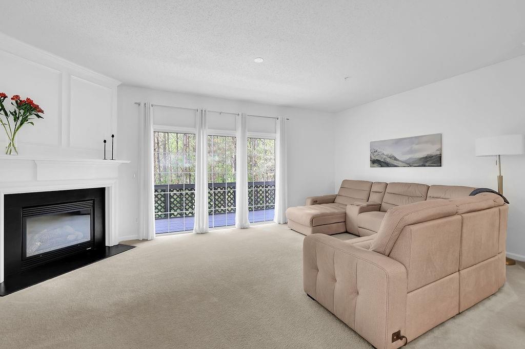 215 Riverstone Commons Circle Canton, GA 30114 - Photo 11 of 36 a bed room with a bed and a fireplace