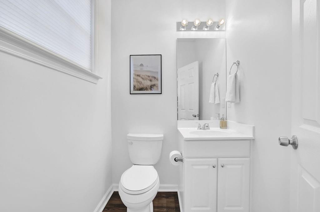 215 Riverstone Commons Circle Canton, GA 30114 - Photo 23 of 36 a bathroom with a toilet sink and mirror