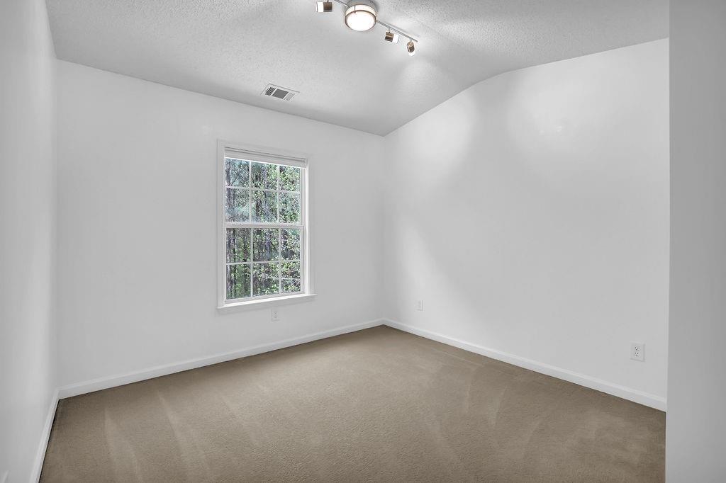 215 Riverstone Commons Circle Canton, GA 30114 - Photo 26 of 36 an empty room with a window