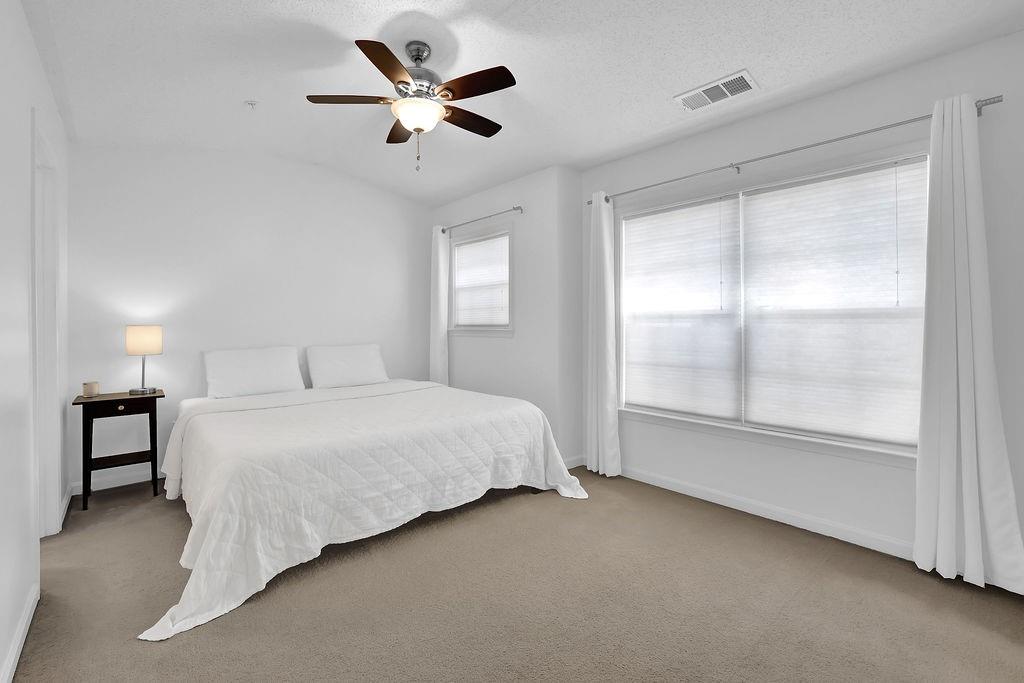 215 Riverstone Commons Circle Canton, GA 30114 - Photo 29 of 36 a bedroom with a bed and a window
