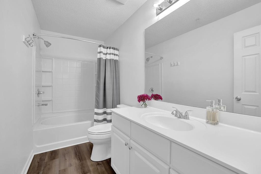 215 Riverstone Commons Circle Canton, GA 30114 - Photo 32 of 36 a bathroom with a sink toilet tub and shower
