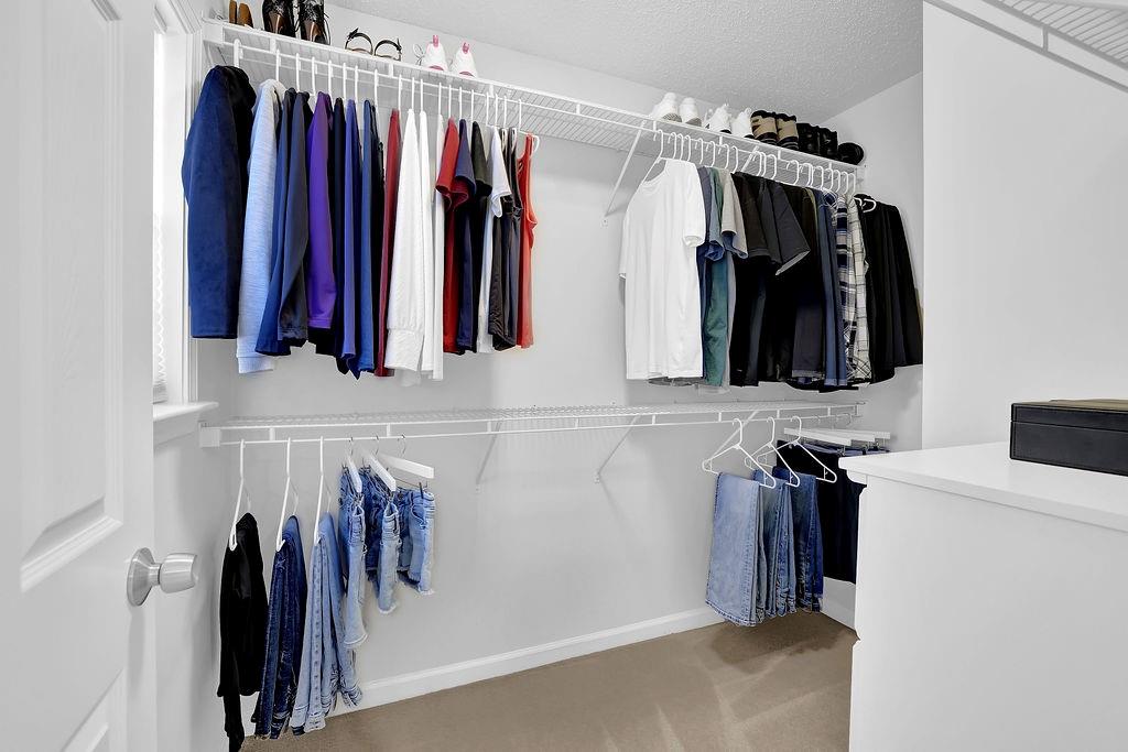 215 Riverstone Commons Circle Canton, GA 30114 - Photo 33 of 36 a view of a walk in closet