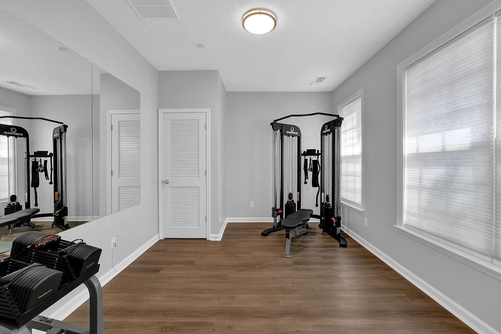 215 Riverstone Commons Circle Canton, GA 30114 - Photo 8 of 36 a view of a room with gym equipment