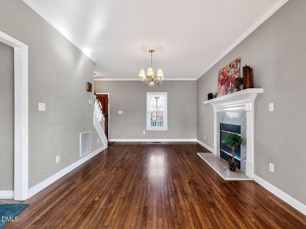 4500 Rivershyre Way Raleigh, NC 27616 - Photo 9 of 42 a view of a room with wooden floor fireplace and windows