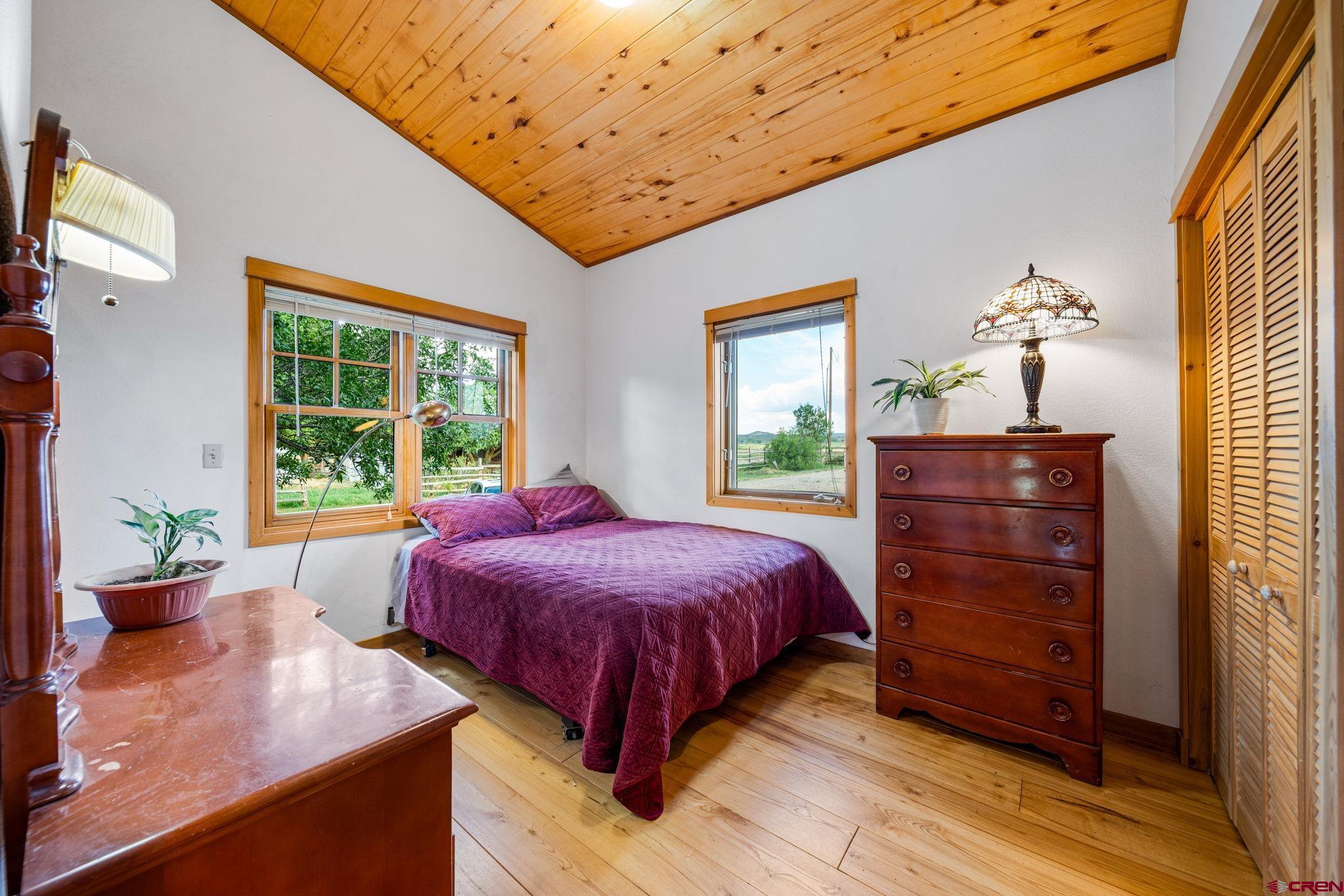 1204 County Road 332 Ignacio, CO 81137 - Photo 16 of 38 a bedroom with a bed and a dresser