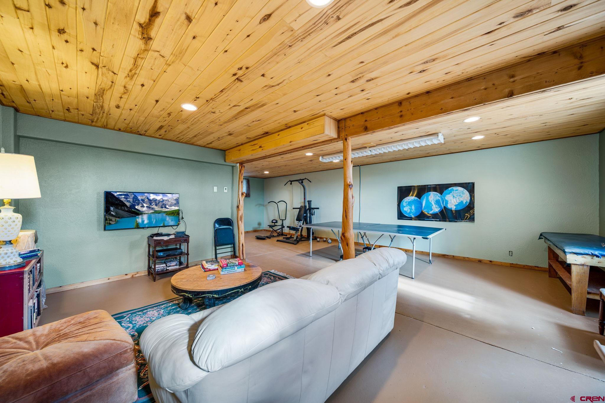 1204 County Road 332 Ignacio, CO 81137 - Photo 20 of 38 a living room with furniture and a flat screen tv