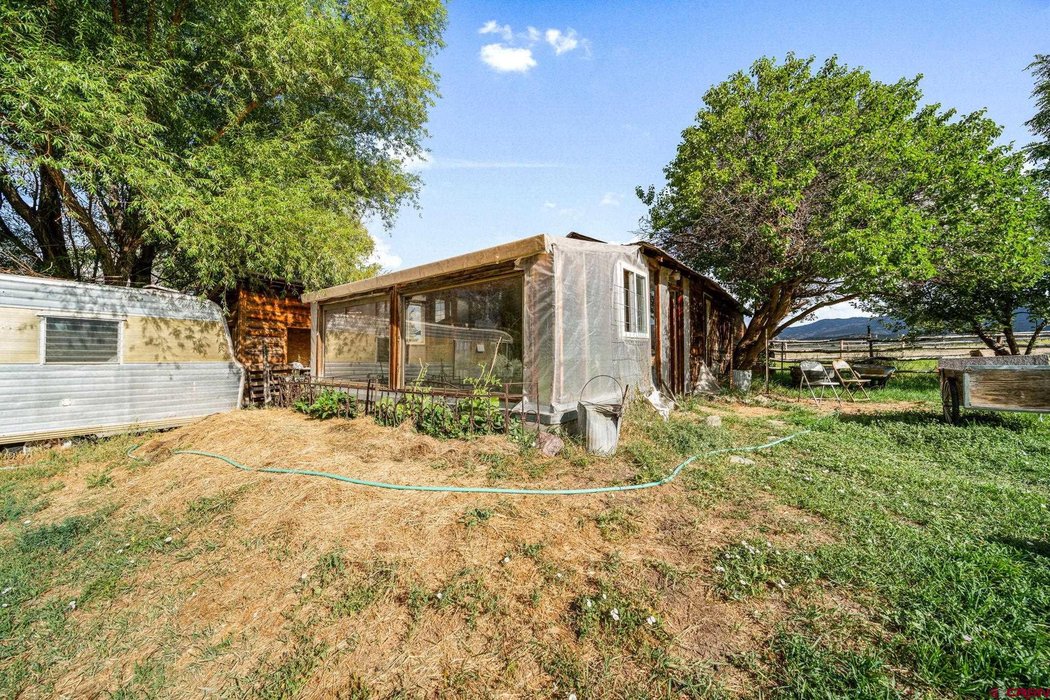 1204 County Road 332 Ignacio, CO 81137 - Photo 36 of 38 a view of a house with backyard and trees