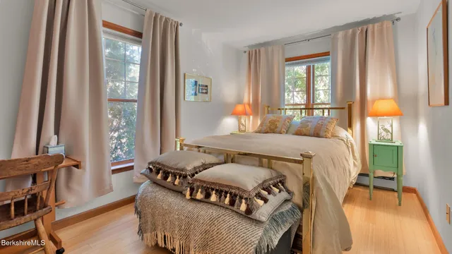 a bedroom with furniture and a window