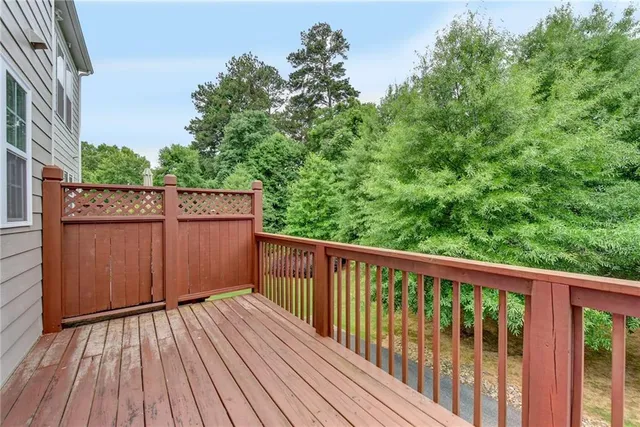 a view of a house with a swimming pool and sitting area