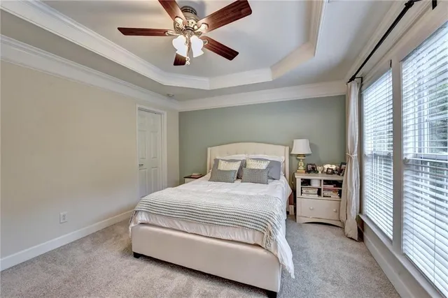 a bedroom with a bed and white walls