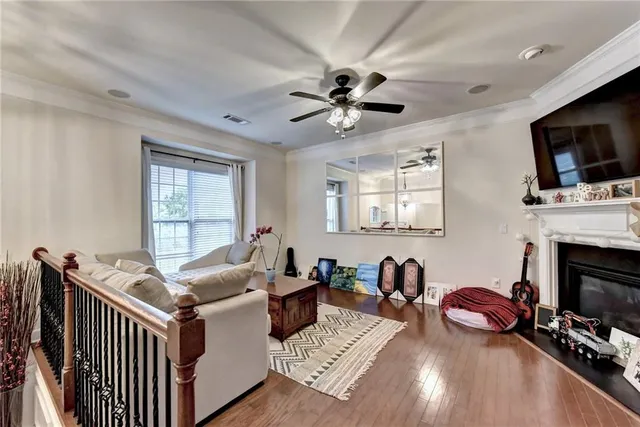 a living room with furniture fireplace and flat screen tv