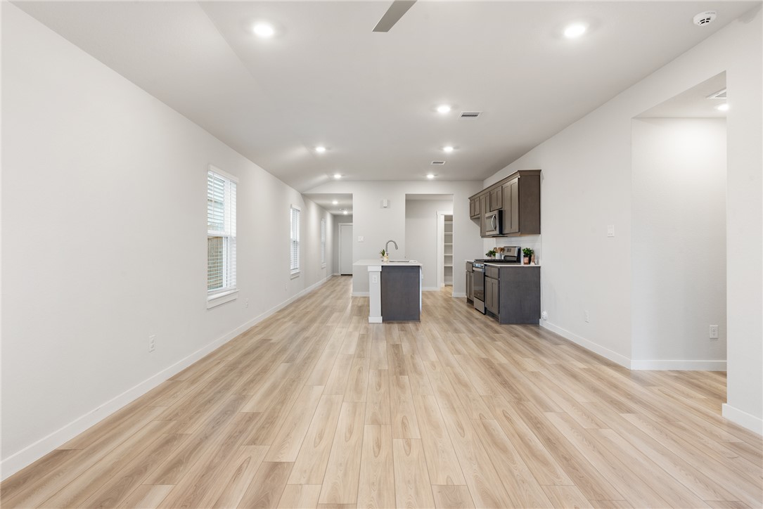 918 Kickapoo Lane College Station, TX 77845 - Photo 15 of 31 a view of kitchen with sink microwave and refrigerator