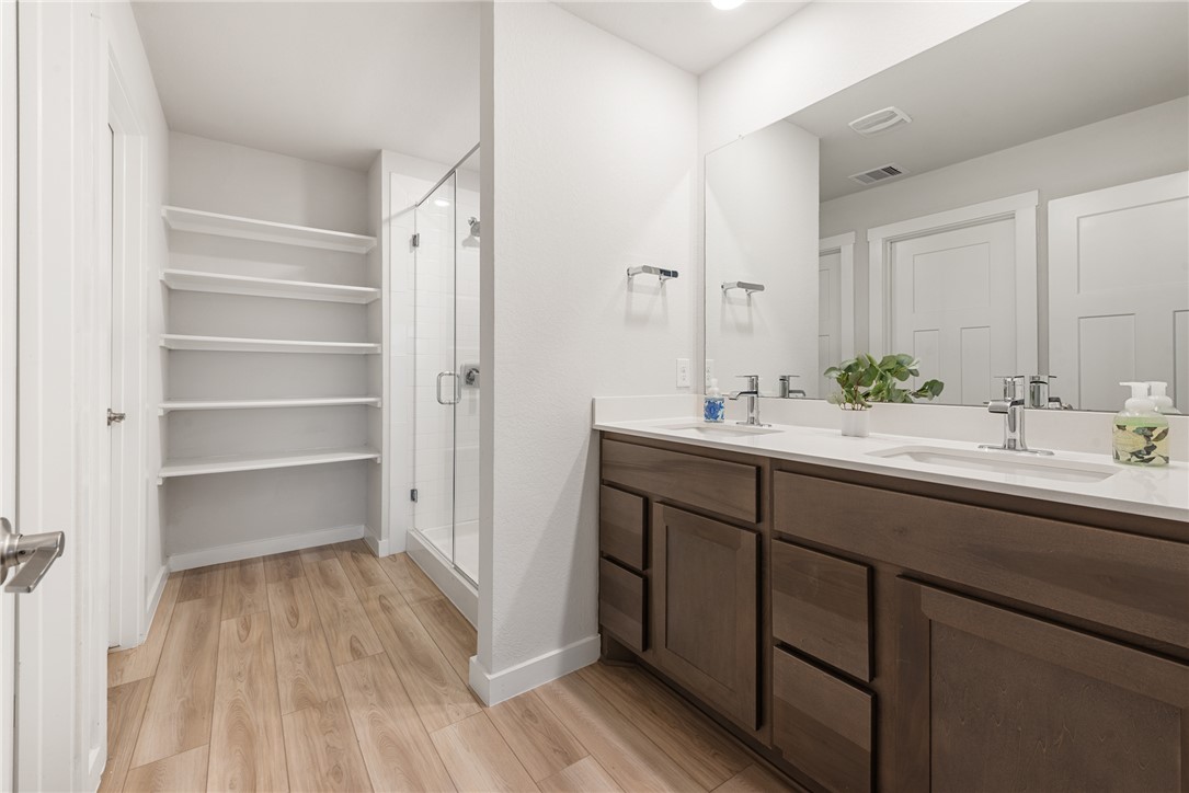 918 Kickapoo Lane College Station, TX 77845 - Photo 19 of 31 a bathroom with a sink and a mirror