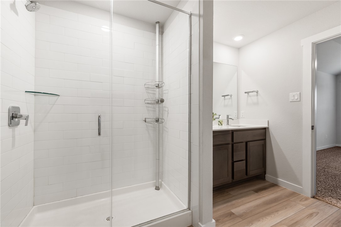 918 Kickapoo Lane College Station, TX 77845 - Photo 21 of 31 a bathroom with a shower and a sink