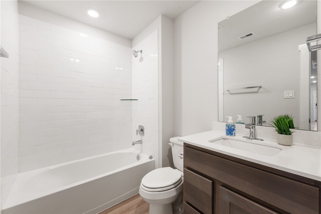 918 Kickapoo Lane College Station, TX 77845 - Photo 27 of 31 a bathroom with a sink a toilet and shower