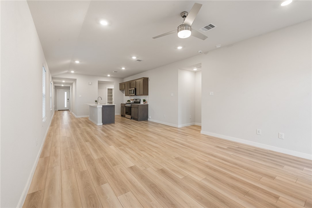 918 Kickapoo Lane College Station, TX 77845 - Photo 4 of 31 a view of empty room with wooden floor