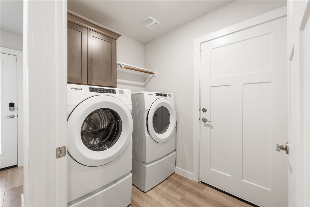918 Kickapoo Lane College Station, TX 77845 - Photo 9 of 31 a view of a hallway with washer and dryer