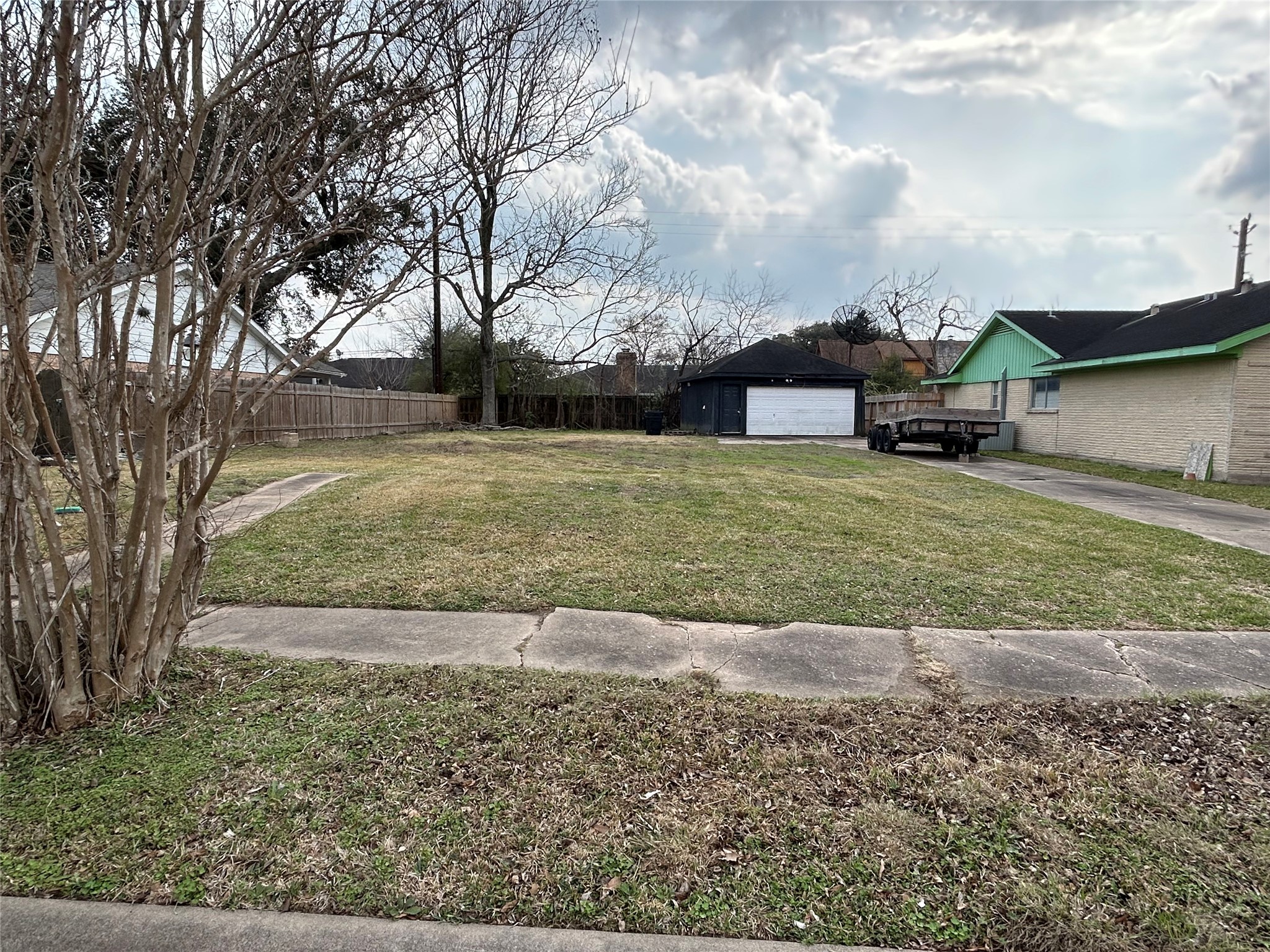 8218 Gulf Spring Lane Houston, TX 77075 - Photo 2 of 7 a view of a big yard with a house