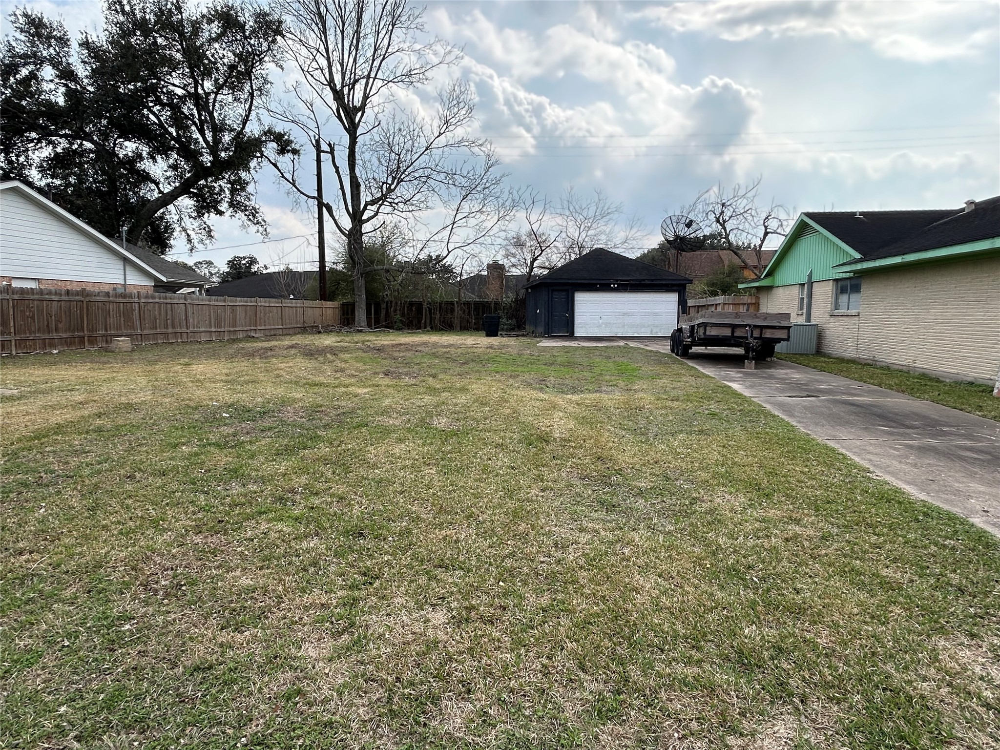 8218 Gulf Spring Lane Houston, TX 77075 - Photo 7 of 7 a backyard of a house with lots of green space