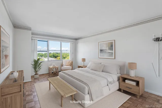 a bedroom with a bed lamps and window