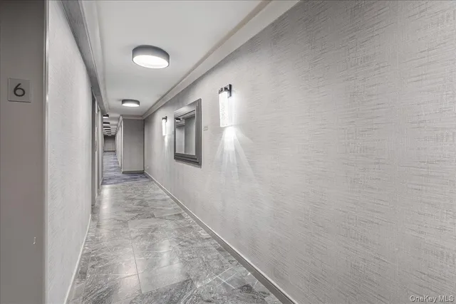 a view of staircase with white walls