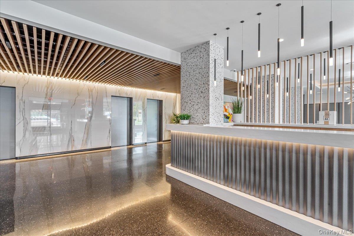 17-85 215th Street, Unit 6A Queens, NY 11360 - Photo 18 of 36 a view of staircase with white walls