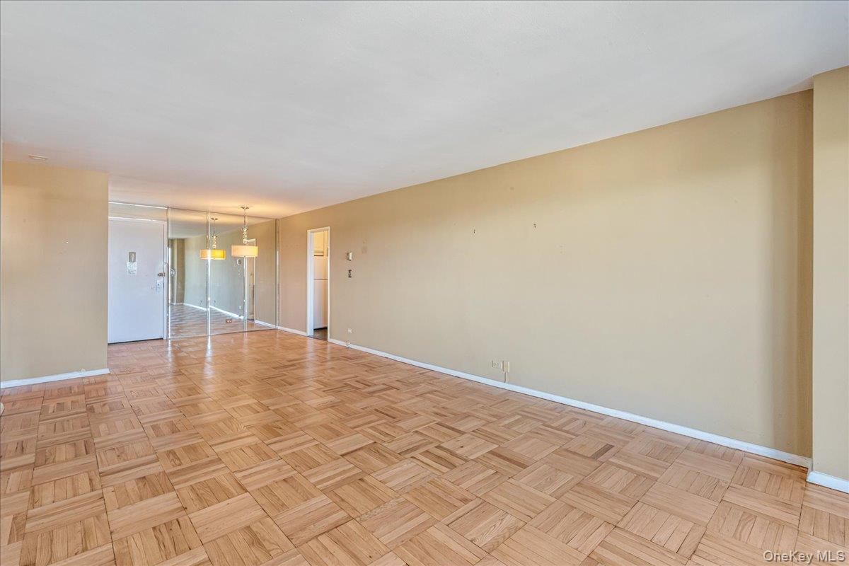 17-85 215th Street, Unit 6A Queens, NY 11360 - Photo 8 of 36 a view of empty room with wooden floor